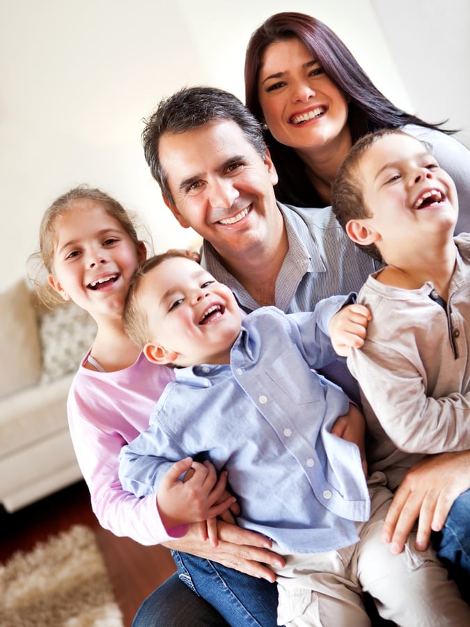 Happy family smiling and having fun together at home